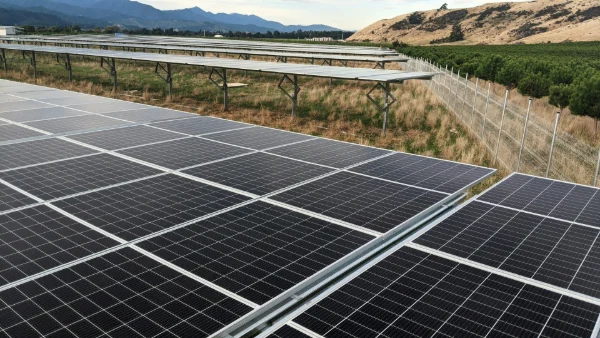 Grid-scale battery energy storage system connected to utility transmission infrastructure for grid stabilization.