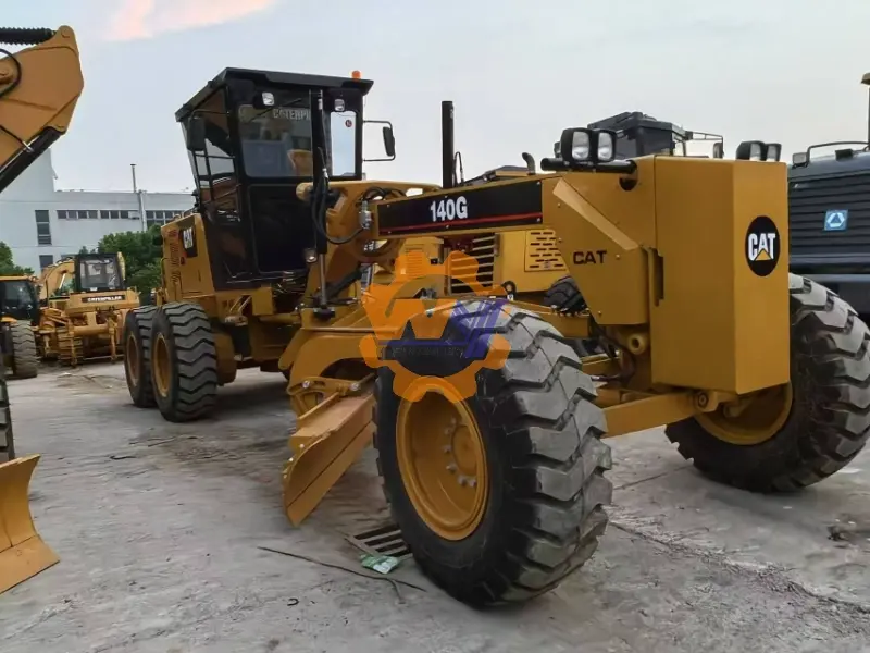 Caterpillar 140G motor grader with Cat 3306 engine on a construction site