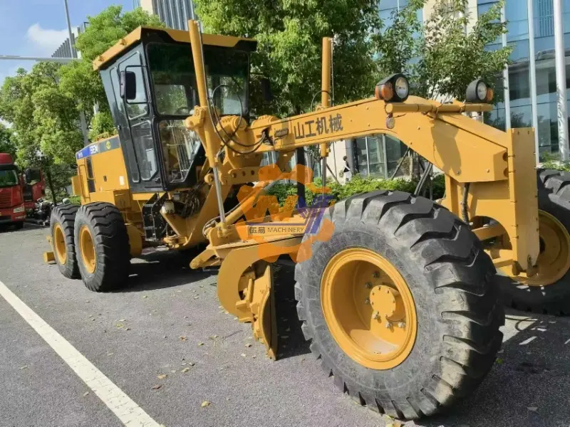 SEM919 motor grader performing grading work on road construction project