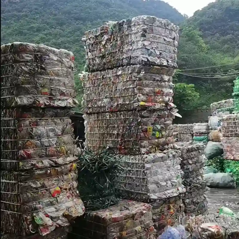 baled whole bottles waiting to be sorted into high purity color and polymer type