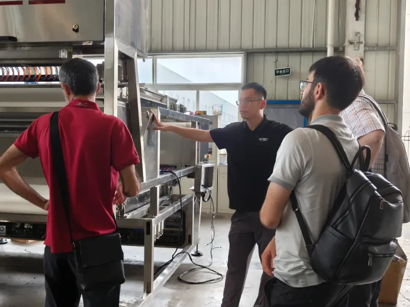 APEX introduces optical sorting machine for overseas customers during factory site visit and equipment inspection