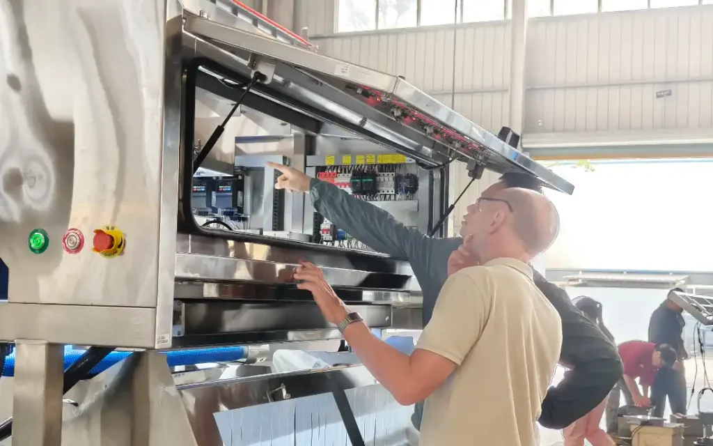 Russian client inspect internal hardware structure of belt‑type sorting machine for fresh and frozen vegetables