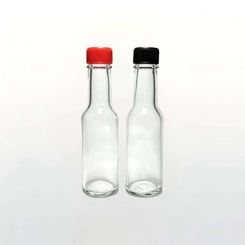 250ml clear long neck glass hot sauce bottle with red and black plastic screw caps, food‑grade condiment glass bottle white background