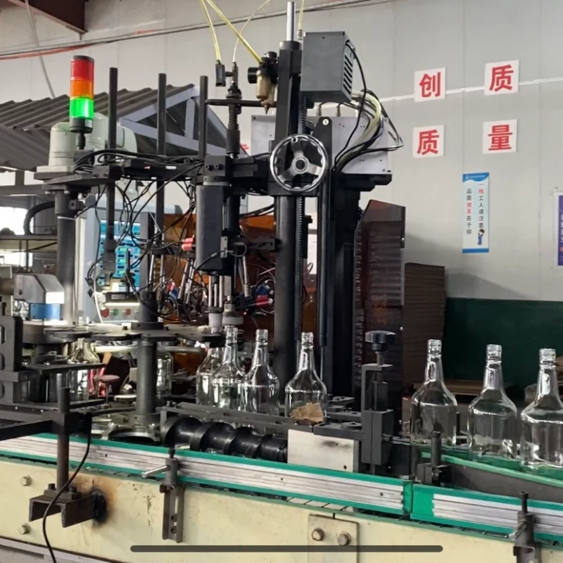 Automatic online inspection machine checking glass bottles for cracks bubbles and dimension defects