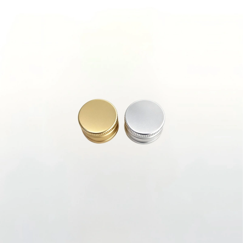 Metallic screw cap for spirit bottle, leak-proof closure, surface customizable to match brand style.