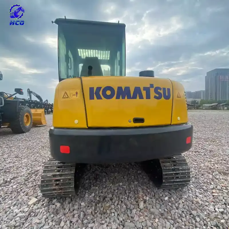 How to tell if a used excavator is repainted - Rear view of a Komatsu excavator with full brand logo paint for repainting inspection