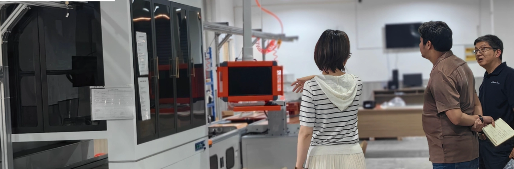 Visitors inspecting JNTech's high-quality battery and inverter production process
