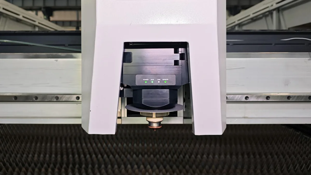 Exchange table laser cutting machine cutting head