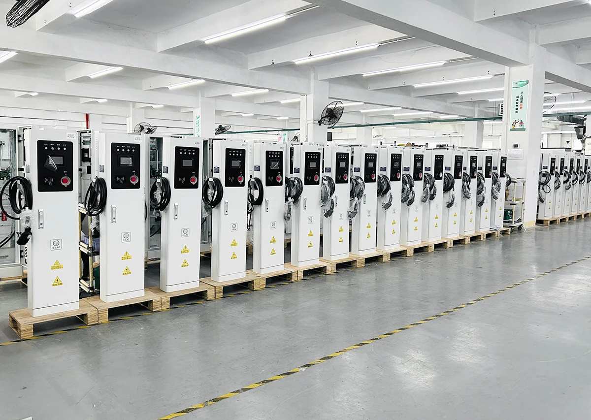 EV charger factory product arrangement, finished electric vehicle charging stations organized on factory floor