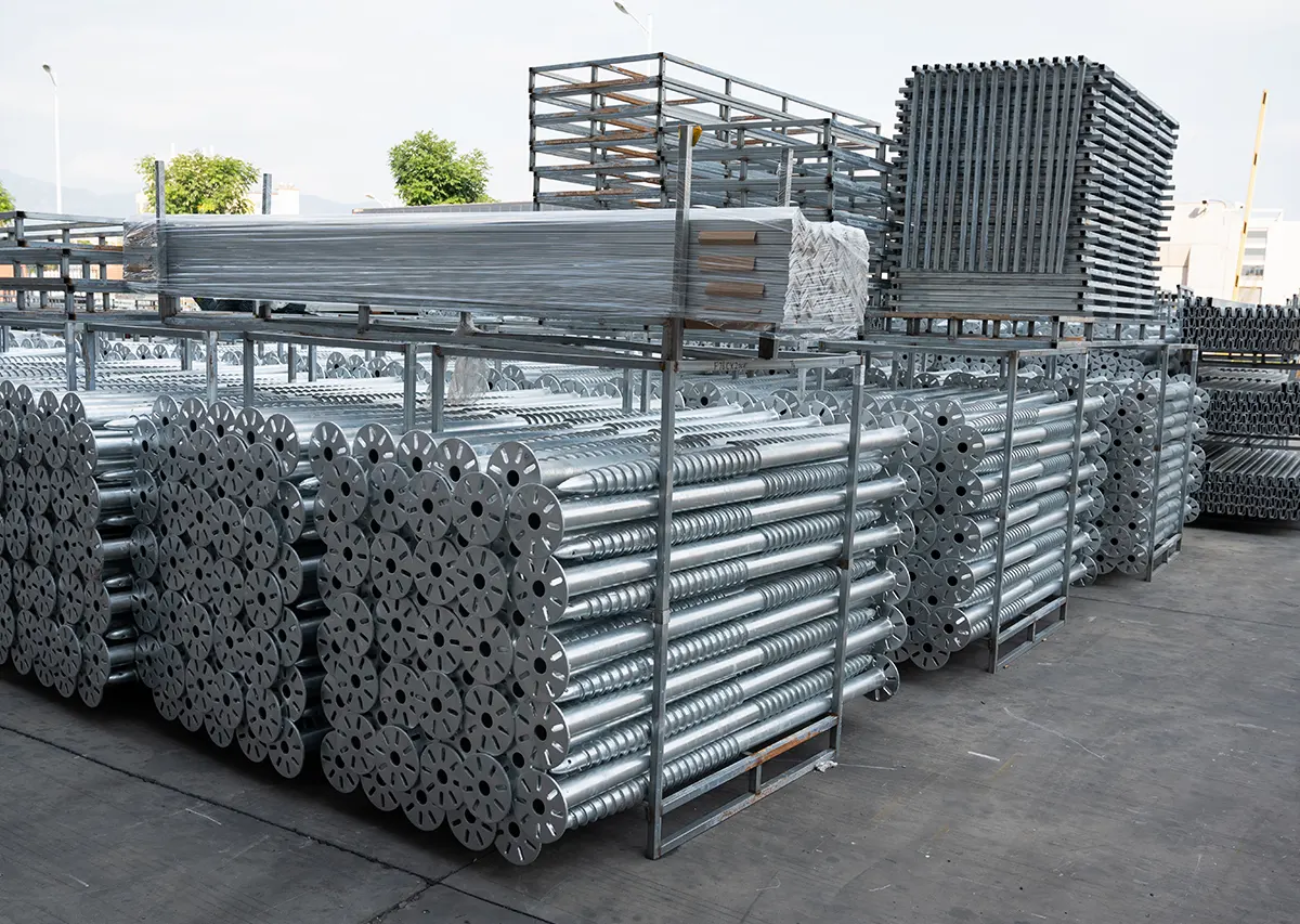 Solar mounting structure storage scene, stacked PV racking and brackets in factory warehouse ready for shipment