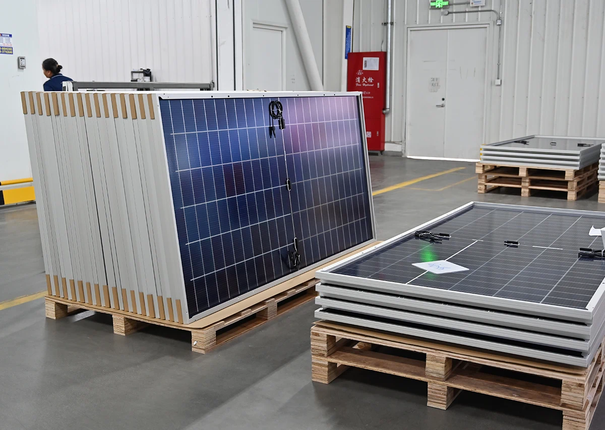 Solar panel packing and storage, finished PV modules stacked on pallets ready for packaging and shipment