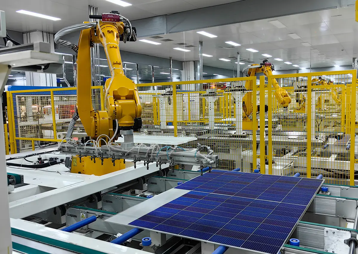 Solar panel pre-lamination stage, stacked layers of glass, EVA, cells, and backsheet ready for laminator