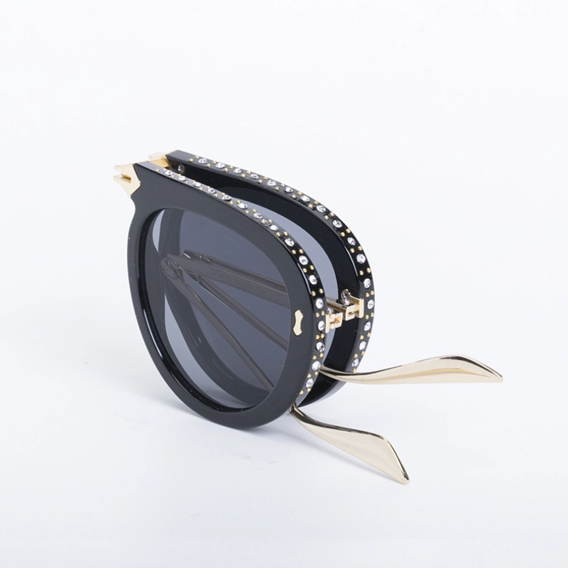 women folding sunglasses